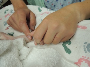 Holding Rayna's hand after her bath.